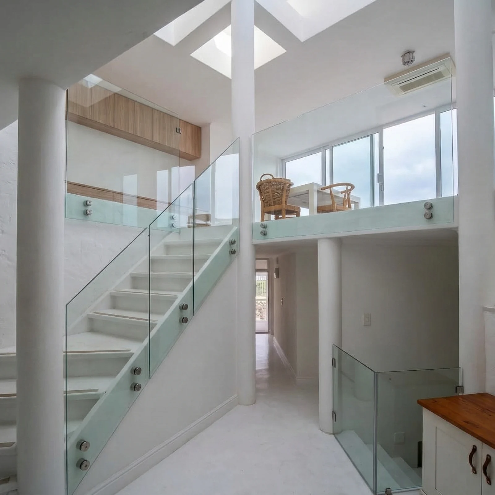 Clean glass balustrade with minimal framing and hardware